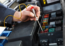 Close-up of electrical repair work on equipment wiring